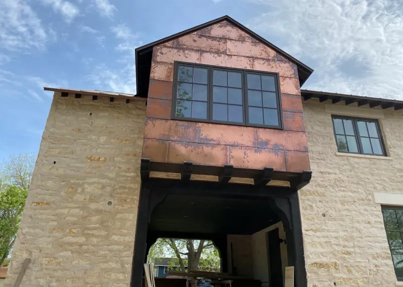 Copper metal panel facade on a stone building for Metal Roof Coating in Ashburnham