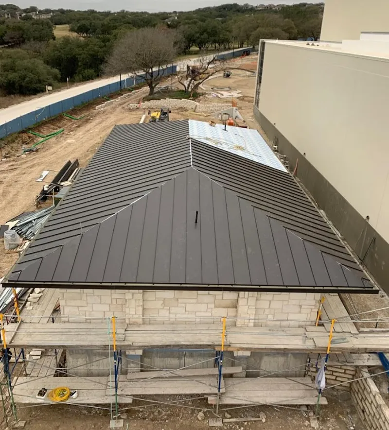 Metal roof new construction with scaffolding in Ashburnham